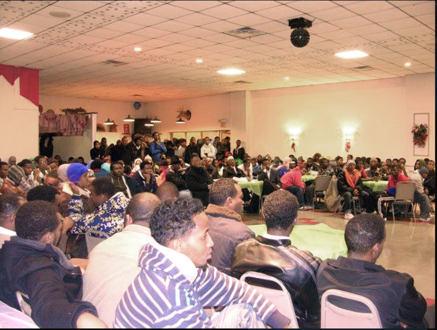 Somali community leaders addressing a townhall meeting